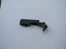 TLHU0269 TRIGGER LOCK / CATCH: Jonsered 2063, 2065, 2071, 2163, 2165, 2166, 2171, 2172, 2186, 2188: Husqvarna 336, 339, 362, 365, 371, 372, 375, 385, 390, 394, 395  OEM = 503-556602, 503-556601